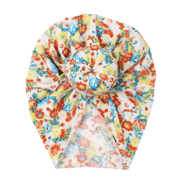 Soft baby hat with a beautiful floral print, stretchable and snug for newborns