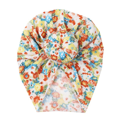 Soft baby hat with a beautiful floral print, stretchable and snug for newborns