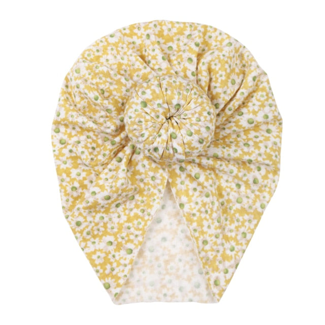 Stretchable floral print infant beanie, offering warmth and comfort for your baby