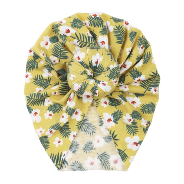 Soft stretchable floral beanie for infants, a thoughtful unisex baby shower gift