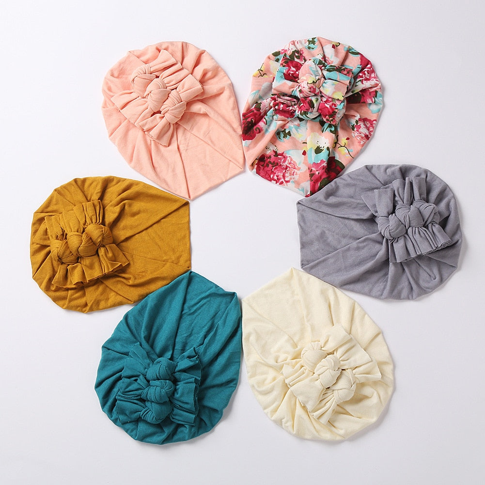 Soft stretchable newborn beanie featuring a charming floral pattern, ideal for babies