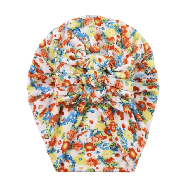 Unisex baby hat with an all-over floral print, comfortable and trendy newborn accessory