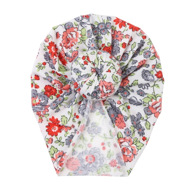 Newborn floral baby beanie, made from soft, stretchable fabric, a perfect baby accessory