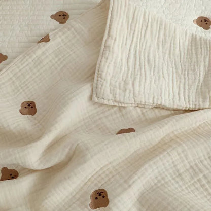 Breathable cotton baby blanket with embroidered duck, perfect for swaddling newborns and adding to nursery decor.