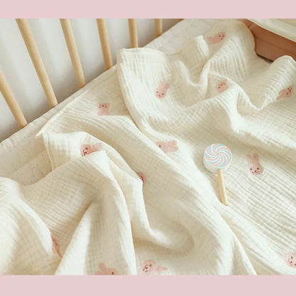 Unisex infant cotton blanket with a whimsical embroidered zebra, perfect for stylish nursery decor and everyday use.