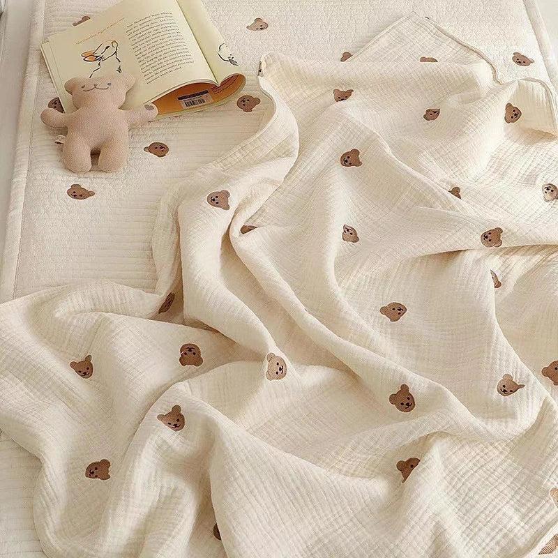 Beige newborn cotton blanket with playful embroidered elephant, a gentle and breathable baby gift for all seasons.