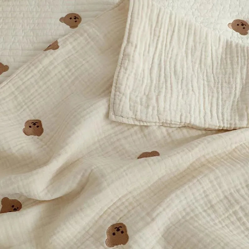 Unisex baby blanket in light blue cotton with delicate animal embroidery of a baby deer, a perfect infant gift.