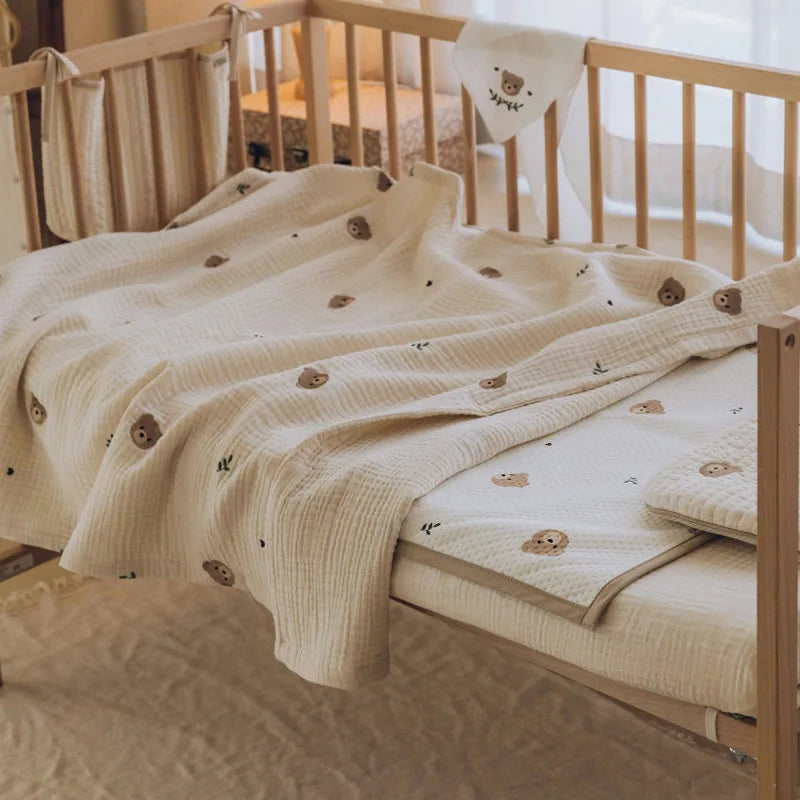 Infant cotton blanket, unisex, featuring a cute embroidered animal parade, ideal for baby shower gifts.