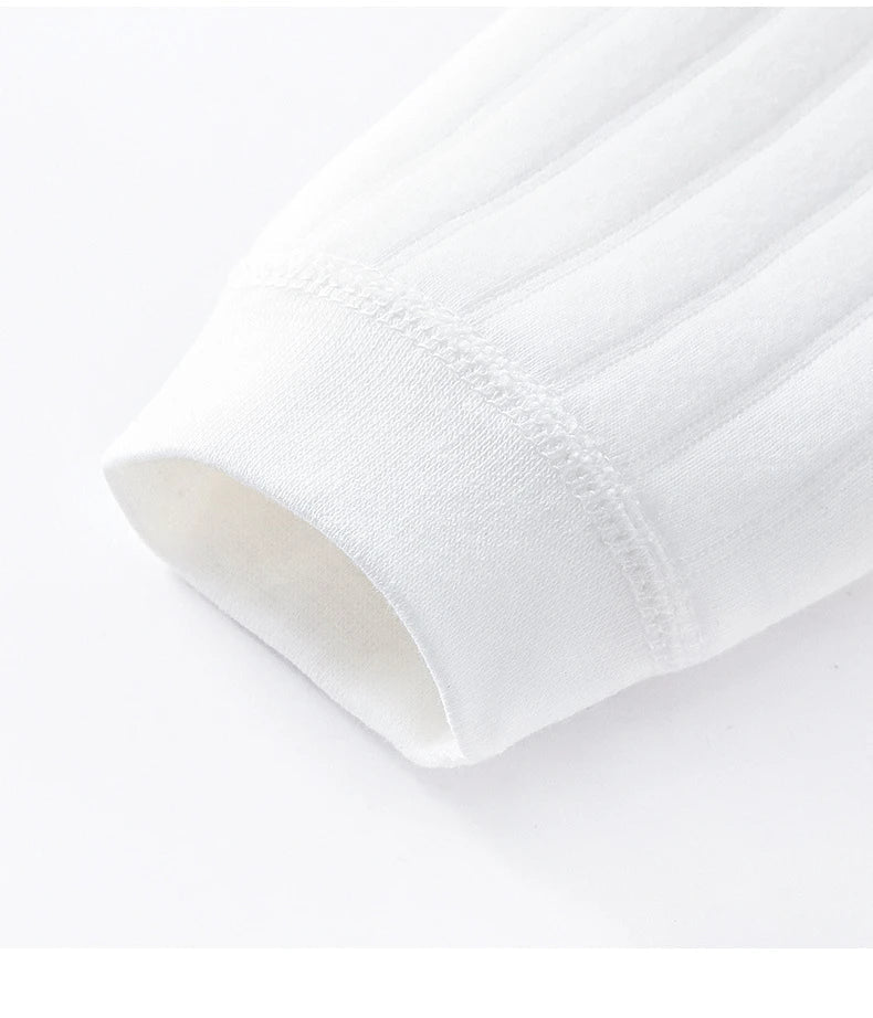 Close-up of the neckline and shoulder of a full sleeve baby romper, gentle on skin