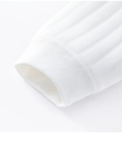 Close-up of the neckline and shoulder of a full sleeve baby romper, gentle on skin