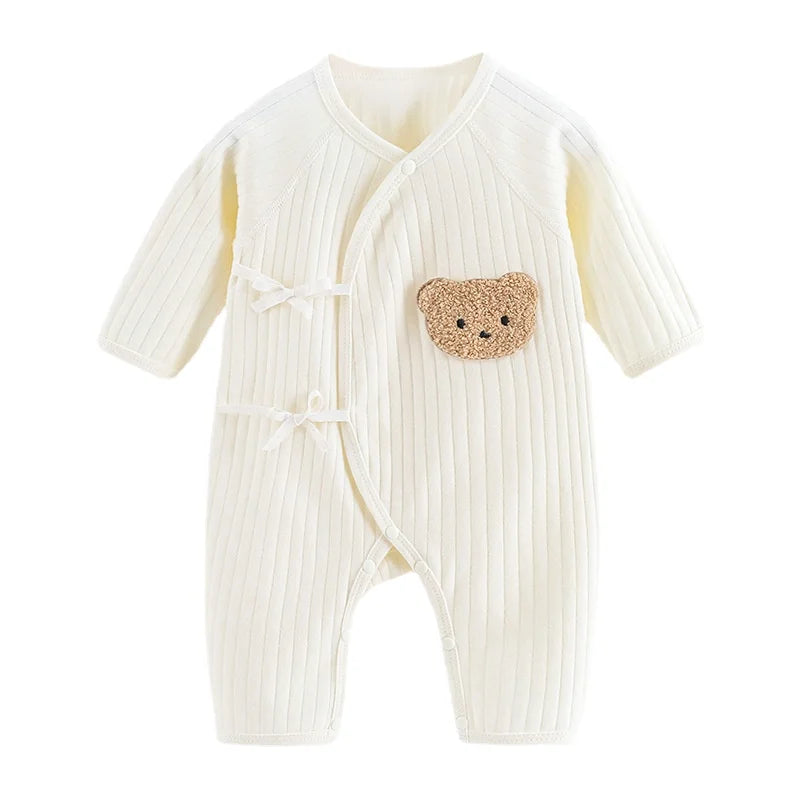 Cute newborn romper in a neutral color, versatile and soft baby fashion