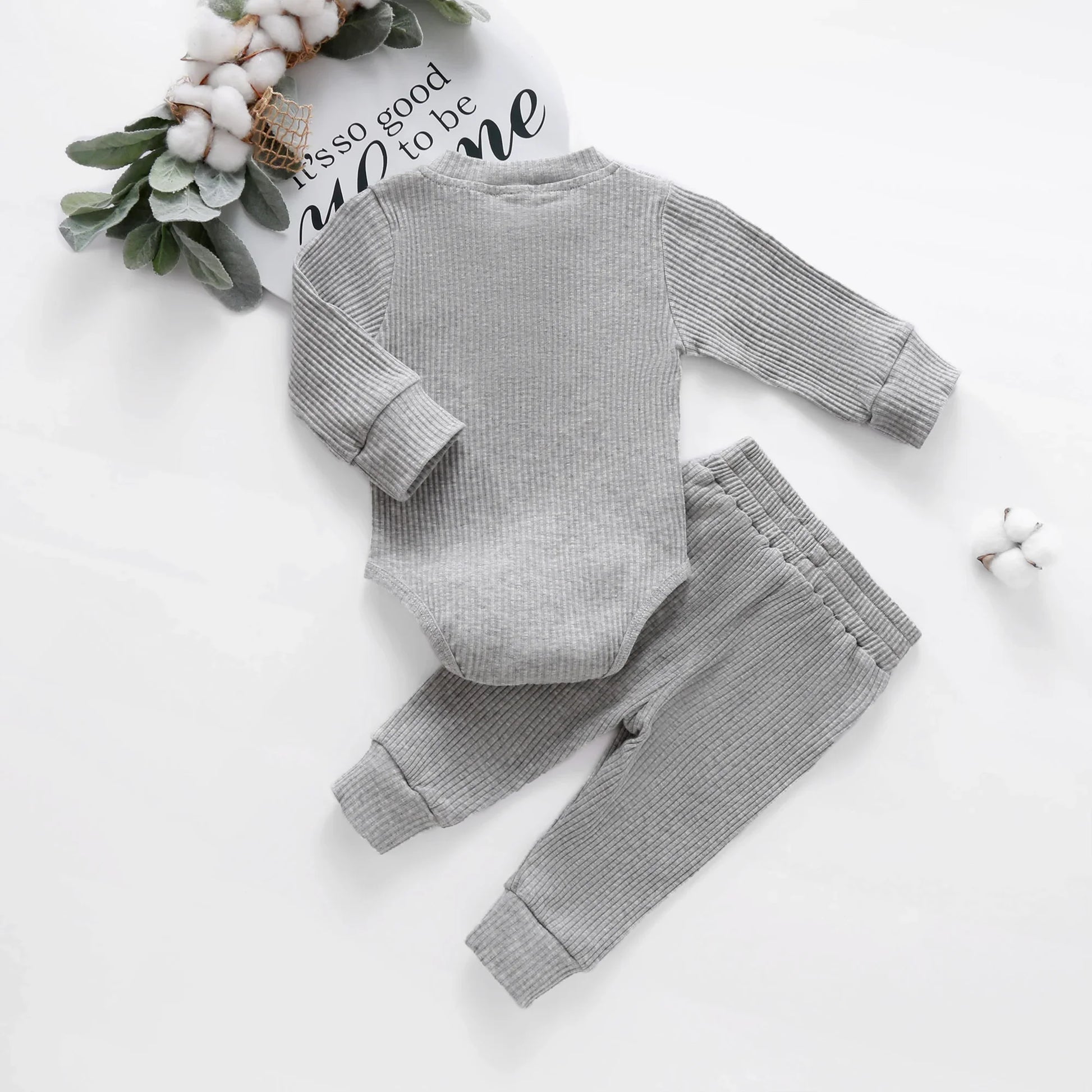 Gift set of unisex newborn knit romper and pants, essential baby wear