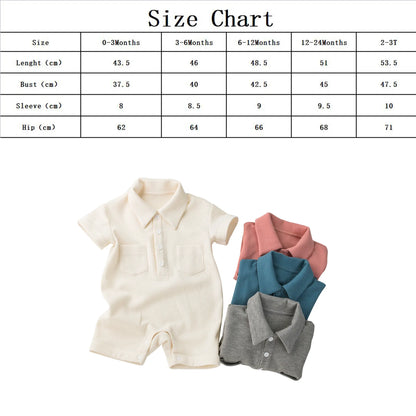 Folded green short sleeve cotton baby outfit, ready for a newborn.