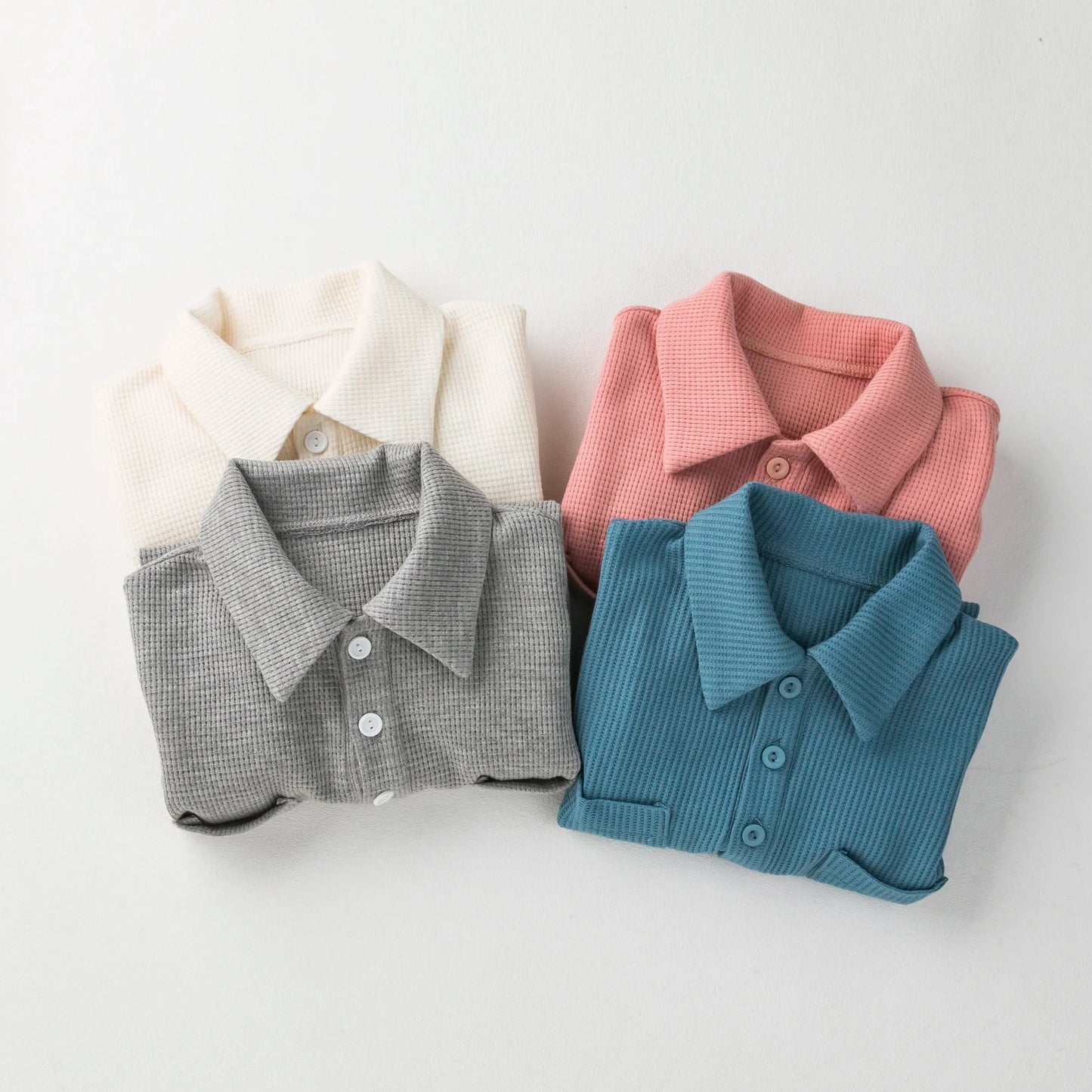 Soft cotton baby jumpsuit for newborns, short sleeves, in a neutral color.