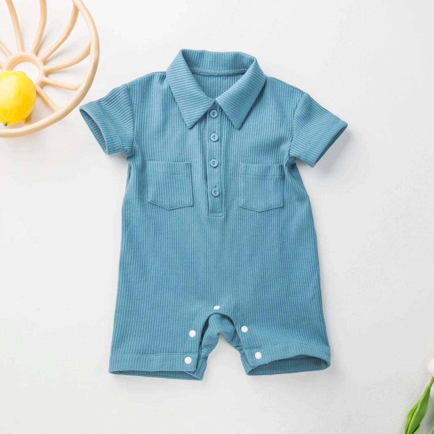 Cute yellow short sleeve baby romper, unisex design, comfortable cotton.