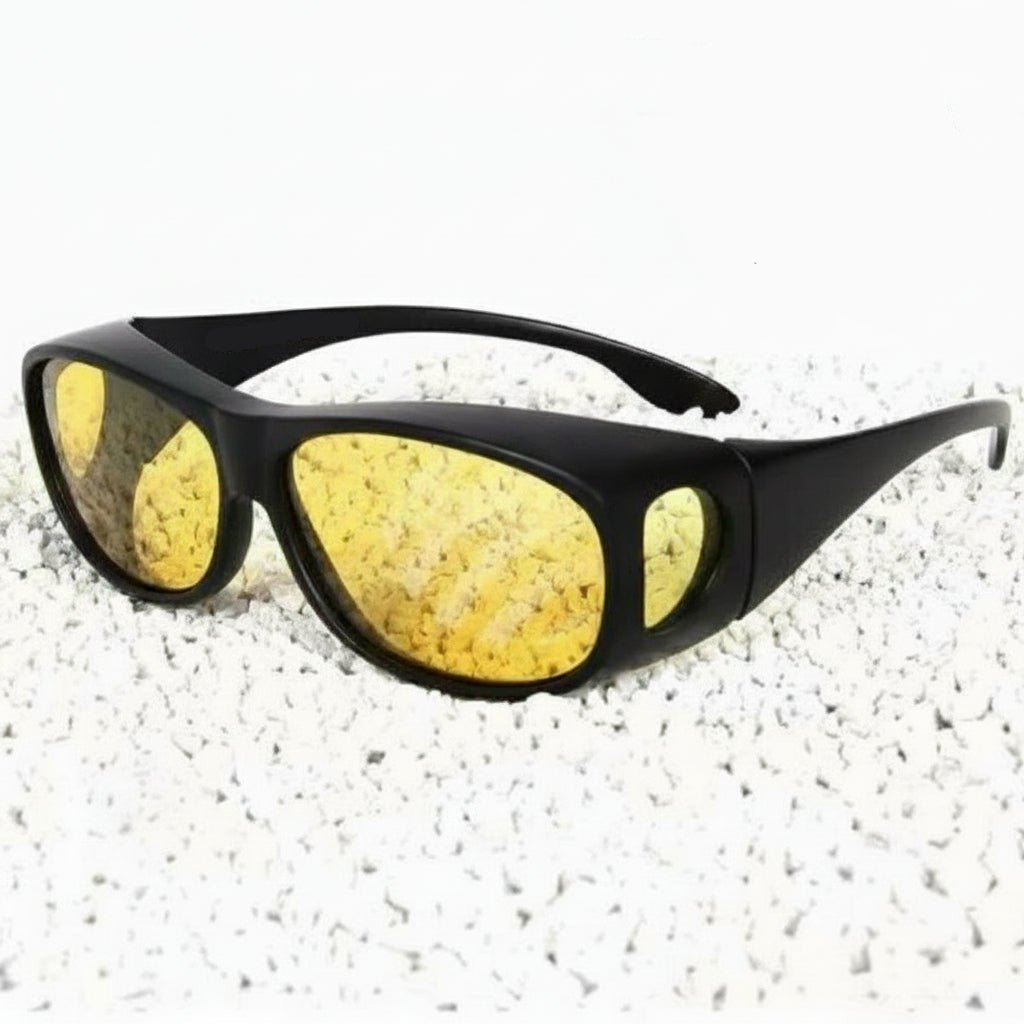 Driver wearing unisex night vision glasses, enhancing road visibility and reducing glare in low light.