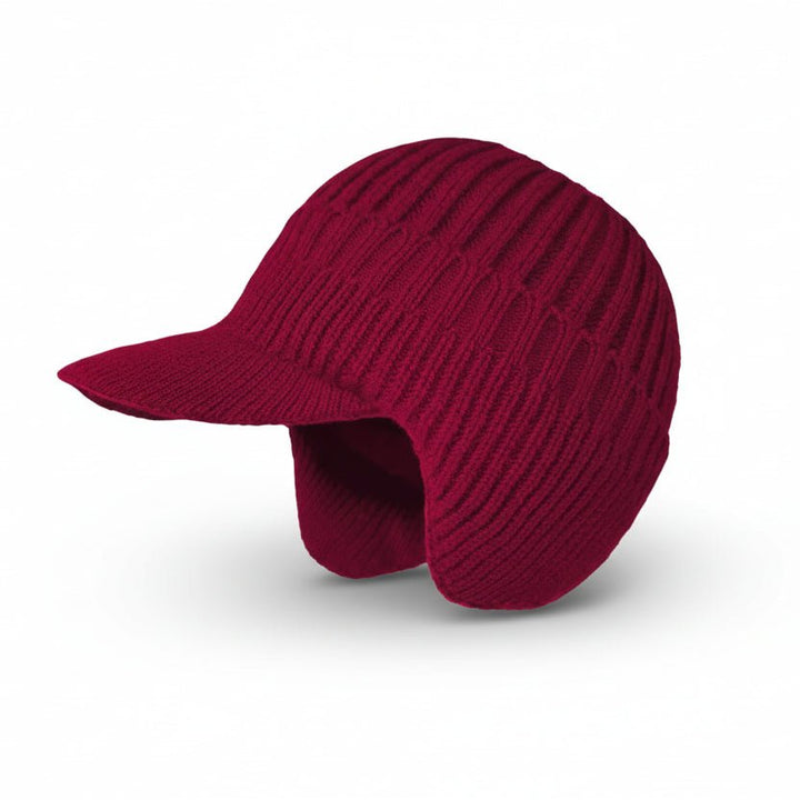 Woman wearing a cozy Nordic winter hat, smiling in the cold. Warm beanie, a perfect women's winter accessory.