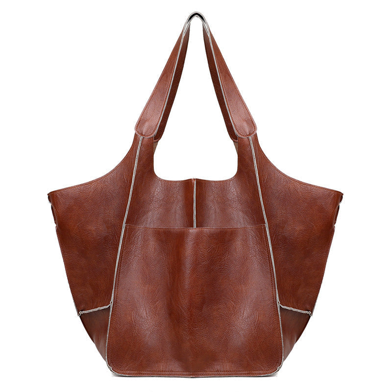 Unisex oversized travel duffel bag, your perfect weekend companion. Stylish & large capacity carry-on weekender.