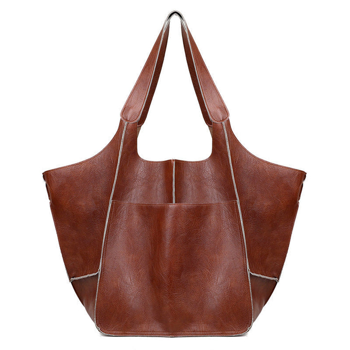 Unisex oversized travel duffel bag, your perfect weekend companion. Stylish & large capacity carry-on weekender.