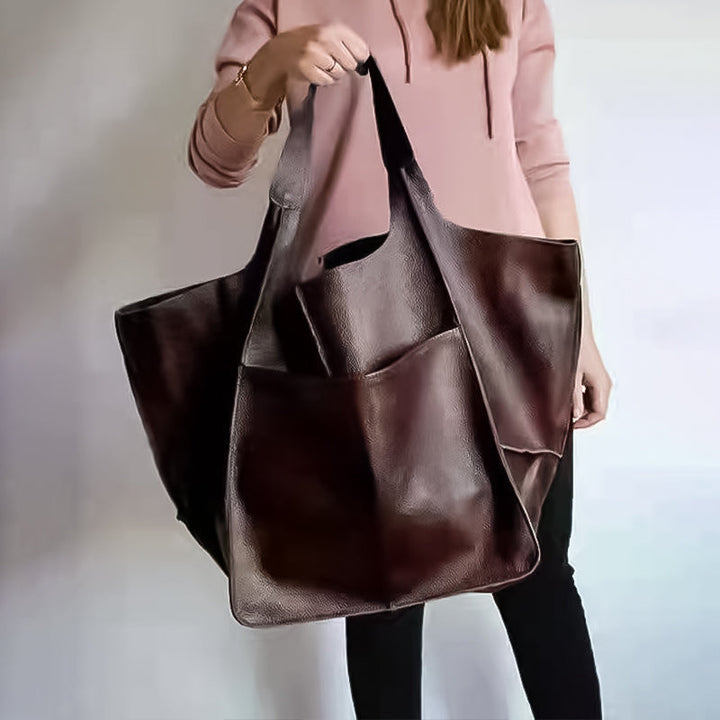 Spacious interior of an open unisex oversized duffel bag, ready for packing a weekender trip.