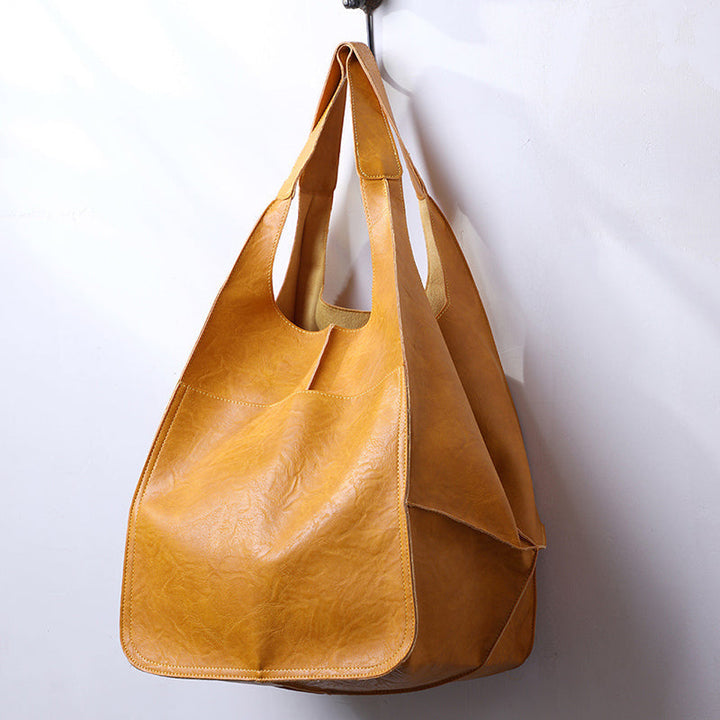 This unisex travel duffel bag is an oversized carry-on, ideal for any stylish weekend getaway.