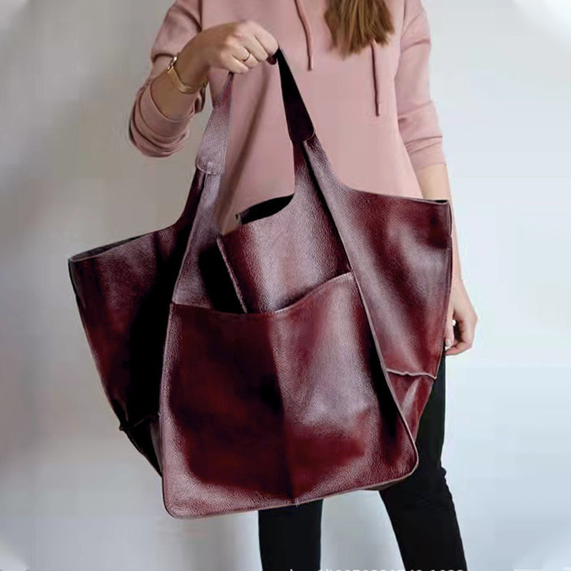 Spacious unisex duffel bag for weekend getaways. Oversized travel bag with large capacity, great travel gift.