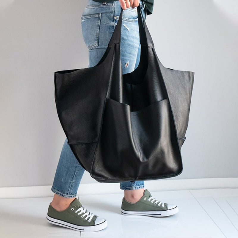 Modern unisex oversized duffel, a versatile weekend bag. Spacious travel bag for any journey.