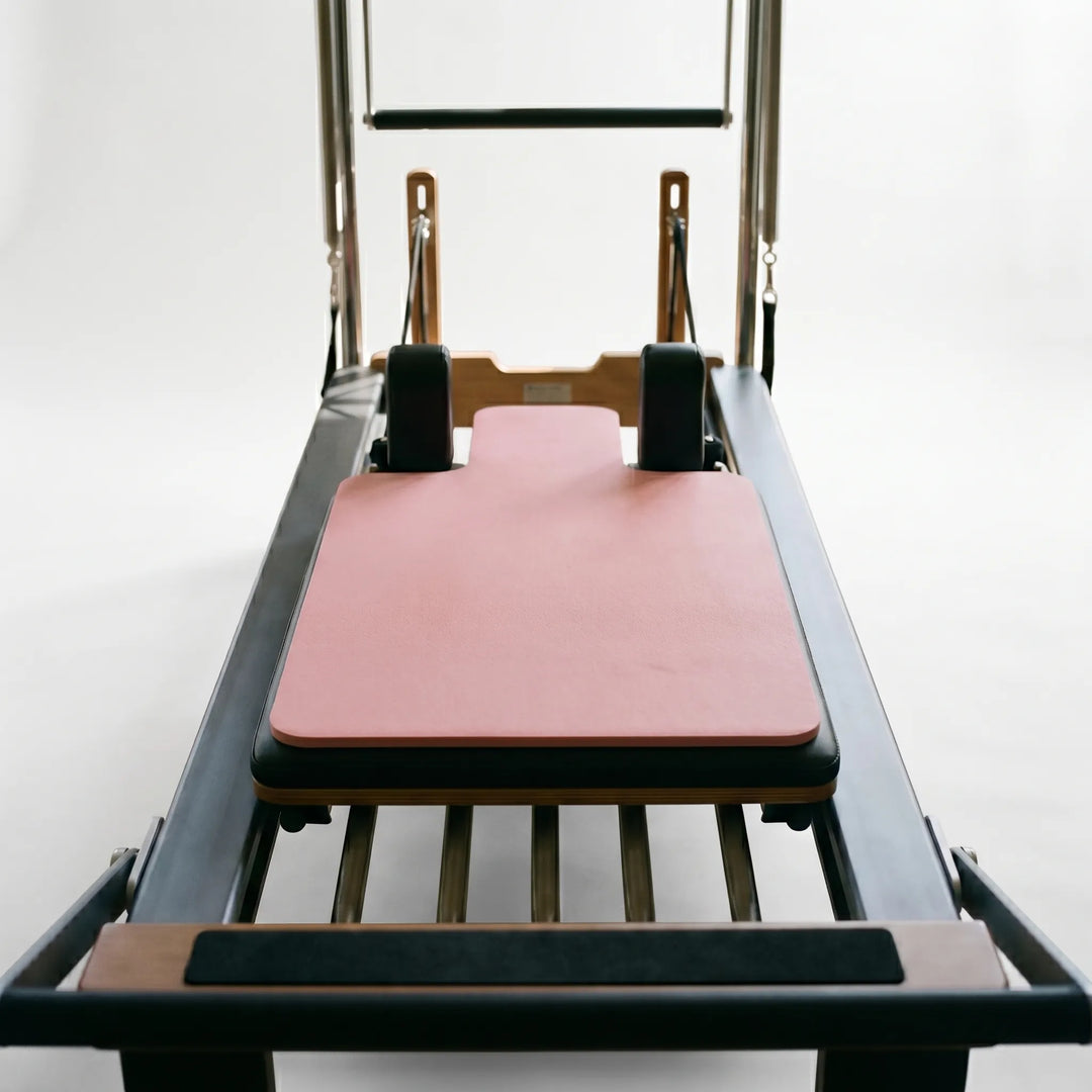 Hygienic sweat-resistant Pilates Reformer Pad for personal use. Easy-clean exercise mat for fitness.