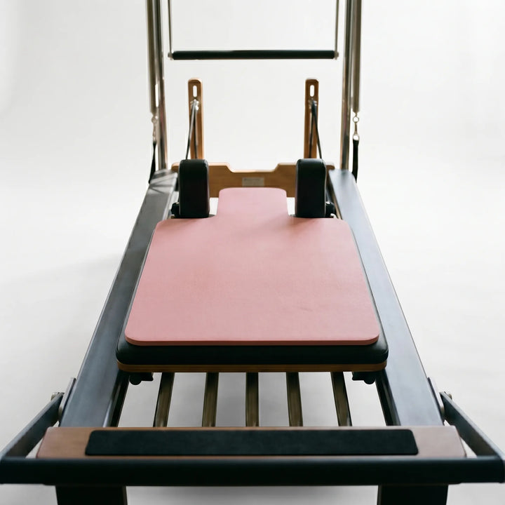 Hygienic sweat-resistant Pilates Reformer Pad for personal use. Easy-clean exercise mat for fitness.