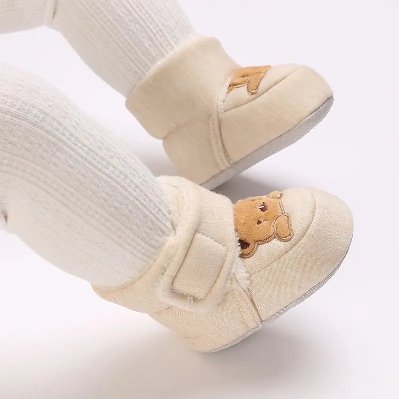 Hook and loop feature on plush bear baby booties, easy to put on and take off