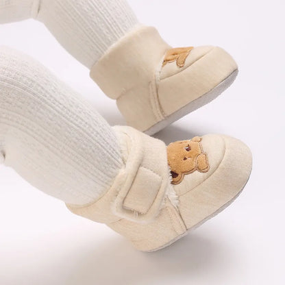 Hook and loop feature on plush bear baby booties, easy to put on and take off