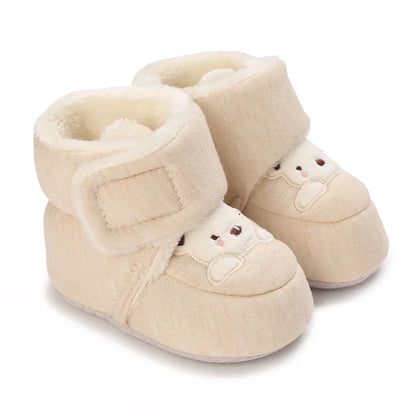 Bottom view of soft sole baby booties with bear design, infant first walker shoes