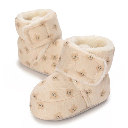 Baby wearing plush bear booties, comfortable and warm infant footwear for winter