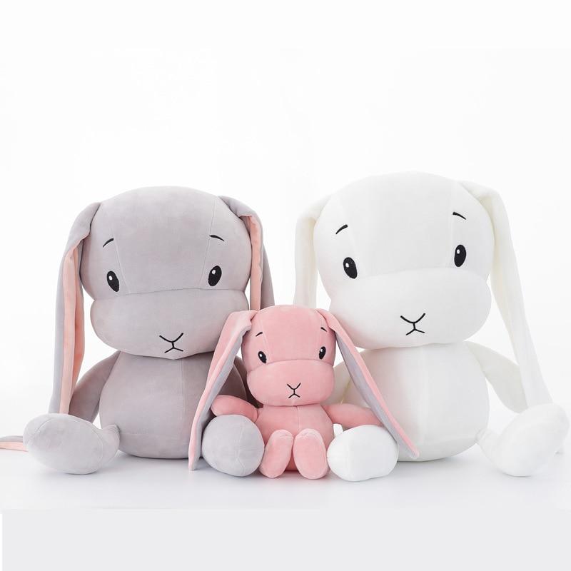 Unisex plush cuddle bunny toy, soft white rabbit stuffed animal for babies and kids.
