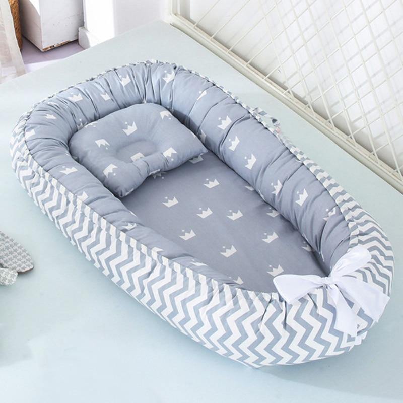 Unisex portable baby lounger & snuggle nest, white with grey trim, soft and supportive for newborns