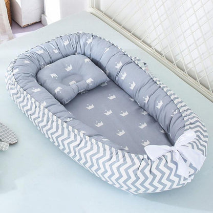Unisex portable baby lounger & snuggle nest, white with grey trim, soft and supportive for newborns