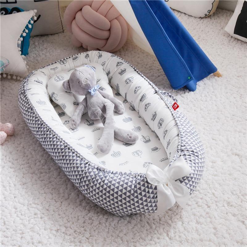 Grey portable baby lounger and snuggle nest, infant bed for safe, comfortable sleep, baby essential