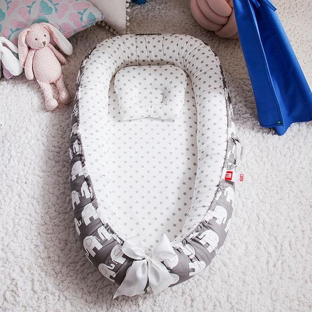 Travel bed for infant: portable baby lounger, snuggle nest design, easy to pack for on-the-go