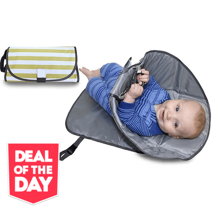 Unisex portable diaper changing pad, grey, folded with magnetic closure, for baby travel. View 1.
