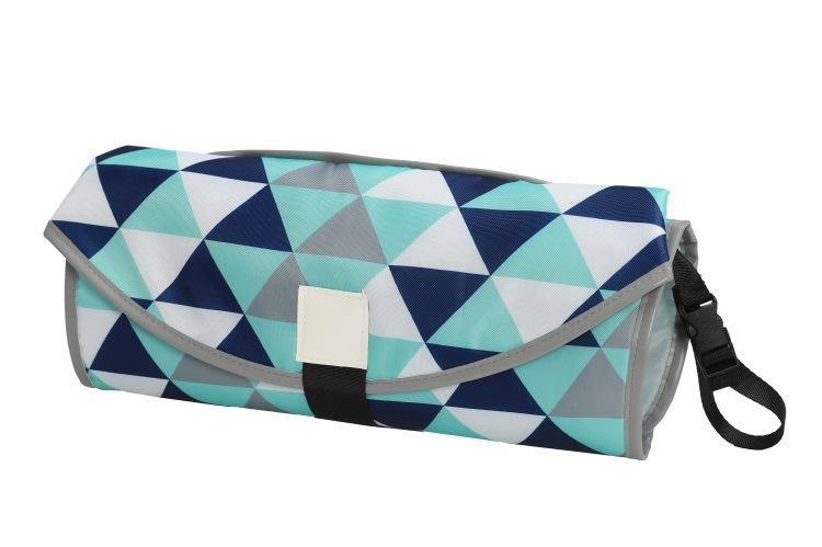Open portable changing pad with cushioned headrest and spacious mesh pockets for baby essentials. View 2.