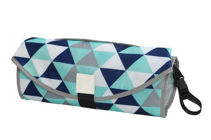 Open portable changing pad with cushioned headrest and spacious mesh pockets for baby essentials. View 2.