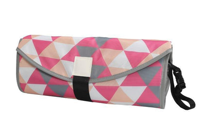 Detail of water-resistant, easy-to-clean surface of the portable diaper changing pad. View 3.