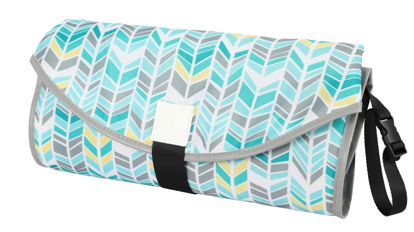 Compact diaper changing clutch with handle, perfect for on-the-go parents and baby transport. View 4.