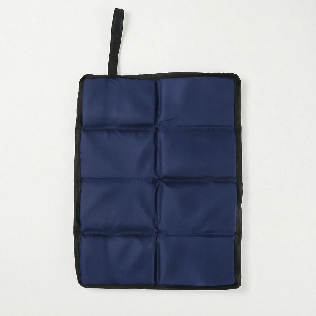 Compact foldable camping seat pad attached to a backpack, essential outdoor gear for hiking & travel.