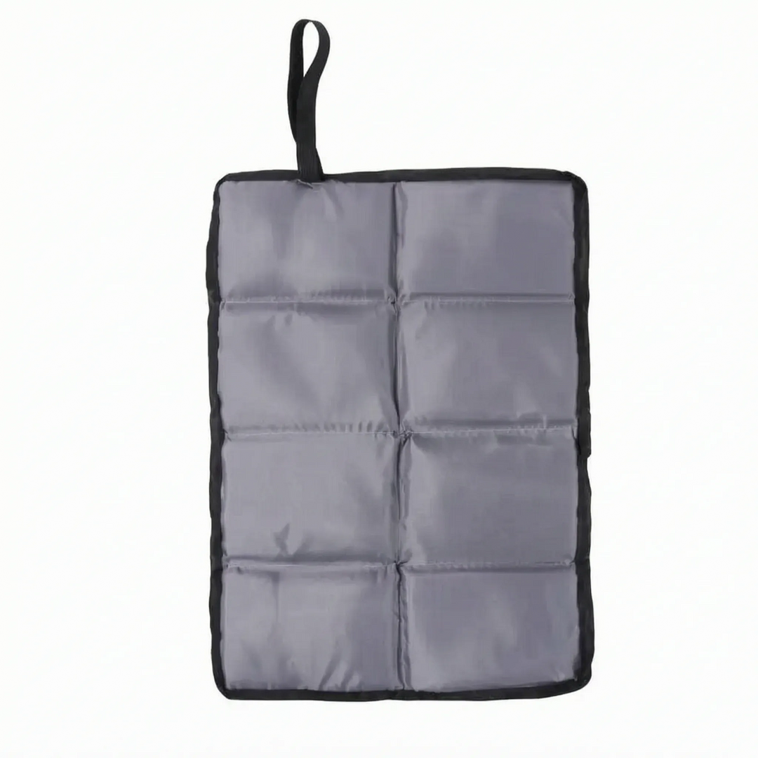 Ultralight portable camping seat pad in hand, perfect foldable cushion for outdoor adventures & travel.