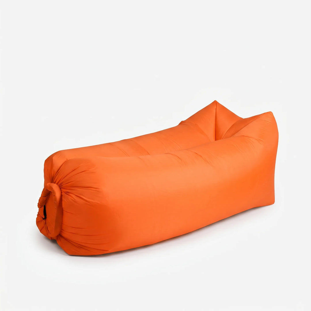 Comfortable inflatable air sofa lounger in durable blue fabric, ideal for backyard relaxation or beach lounging.
