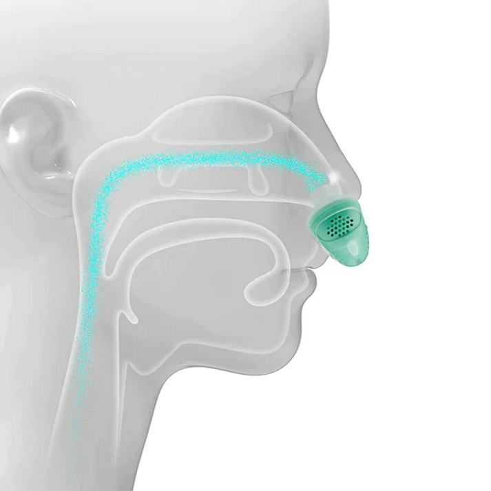 Person using discreet, portable micro CPAP for sleep apnea. Hoseless anti-snoring breathing aid for better sleep.