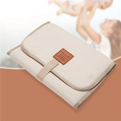 Foldable travel baby changing mat, waterproof and compact, ideal for newborns and infants