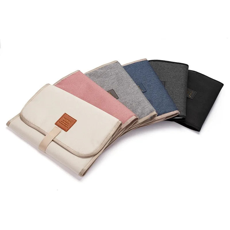 Portable diaper changing pad with head cushion, waterproof, unisex, perfect for baby travel gear