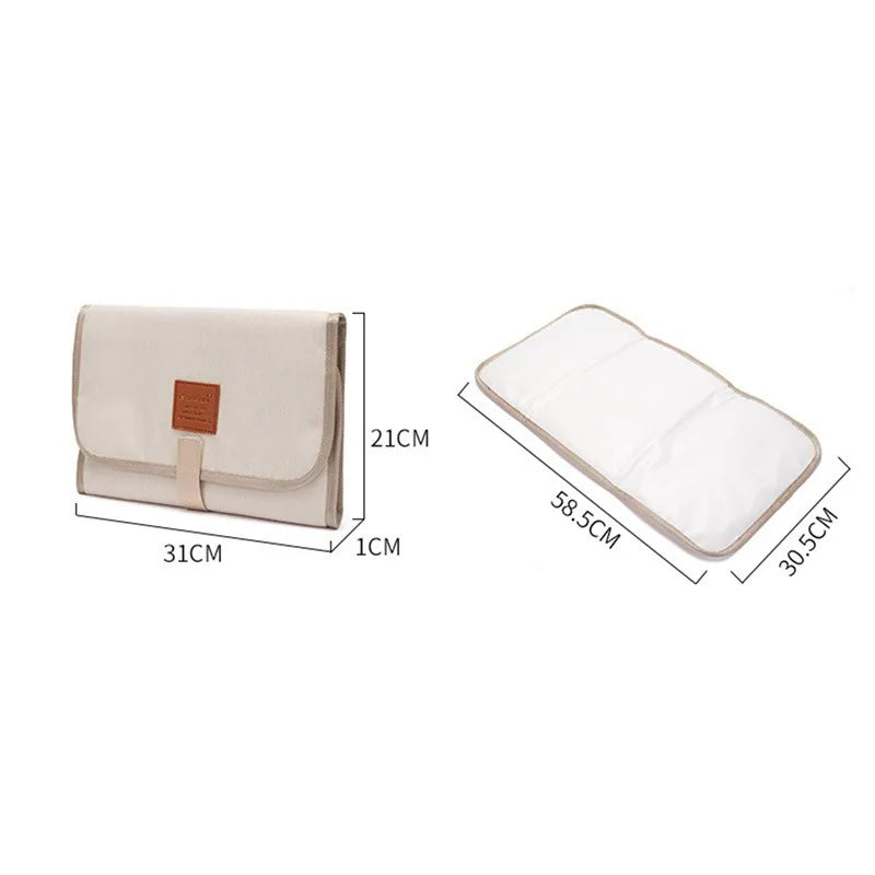 Grey portable baby changing station, waterproof and easy to clean, a newborn essential